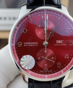 IWC Portugieser Chronograph IW371629 "Year of the Dragon" (ZF Factory) in stainless steel with a rich burgundy red dial, gold-plated hands, and a black leather band.